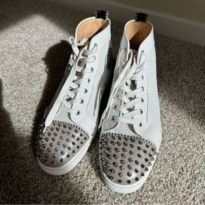 CHRISTIAN LOUBOUTIN
Lou spike-embellished leather trainers